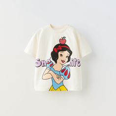 Zara Disney Snow White Tshirt 12-18 Months Zara Cartoon Print Crew Neck T-shirt, Disney Character Print Tops For Playtime, Character Style Cotton Short Sleeve Tops, Cute Character Print T-shirt For Disney Fan Events, Cotton Character Print Tops, Cute Zara T-shirt With Letter Print, Zara White T-shirt With Cartoon Print, Character Graphic Print Short Sleeve Tops, Zara Crew Neck T-shirt With Character Print