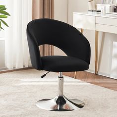 a black office chair sitting on top of a white rug in front of a desk