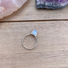 💙Opalite Wire Wrapped Ring - 1 Ring💙 This ring features a small (6mm) opalite stone bead, wrapped in your choice of wire. The options are silver plated, copper, bronze, black, or gold colored wire. All except the silver plated have a non tarnish coating so they will never oxidize or change color. Being careful to not wear your rings while showering or washing your hands a lot will make the silver rings last longer. Pease keep in mind that these are made to order, and the stone color may vary s Nickel Free Adjustable Opal Promise Ring, Adjustable Nickel-free Opal Promise Ring, Adjustable Moonstone Healing Ring, Adjustable Moonstone Ring For Healing, Adjustable Stackable Crystal Moonstone Ring, Adjustable Blue Opal Ring, Adjustable Opal Crystal Ring For Promise, Blue Moonstone Crystal Ring As Gift, Adjustable Opal Crystal Ring For Promise Occasions