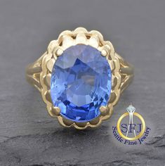 "Restored Vintage Sapphire 5 Carat Solitaire Fluted Ring, Solid Yellow Gold. METAL: Solid Yellow Gold, Stamped 10K GEMS: 1 Lab Sapphire-- 5.5 ct CURRENT SIZE: 6 1/4. Expert resizing service available. Safe resize range for this ring: 5--9. See below to purchase resizing. APPRAISED VALUE: $1,405 This fluted edge solitaire ring is crafted in solid yellow gold, and features a large 5.5 carat blue lab sapphire. The nicely made gallery sits the gem basket a good height above the finger, adding maximu Classic Oval Sapphire Ring, Classic Sapphire Ring With Halo Setting, Vintage Gia Certified Sapphire Ring For Formal Occasions, Classic Sapphire Diamond Ring, Vintage 14k Gold Rings Gia Certified, Classic Collectible Sapphire Ring, Classic 14k Stamped Sapphire Ring For Anniversary, Timeless 14k Stamped Oval Sapphire Ring, Timeless Oval Sapphire Ring Stamped 14k