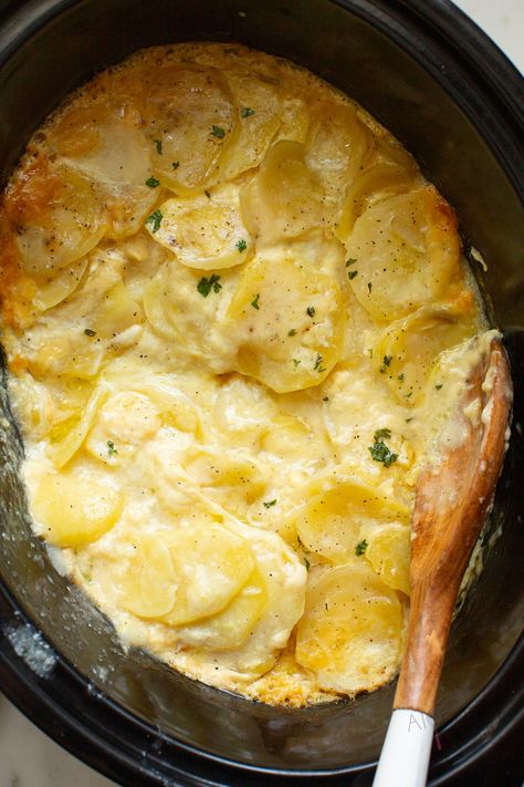 Easy, creamy scalloped potatoes from scratch with simple ingredients. Cook this potato casserole slowly in the crock pot until, creamy, tender, golden, and bubbly. Potato perfection! #alyonascooking easyrecipe #scallopedpotatoes #potatorecipe #creamypotatoes #sidedish #easysidedish #festiveside #Thanksgiving #noroux #casserole #crockpot Crock Pot Scalloped Potatoes, Crockpot Scalloped Potatoes, Potato Recipes Crockpot, Easy Cheesy Scalloped Potatoes, Scalloped Potatoes Crockpot, Slow Cooker Scalloped Potatoes, Easy Scalloped Potatoes Recipe, Creamy Scalloped Potatoes, Scalloped Potatoes Easy