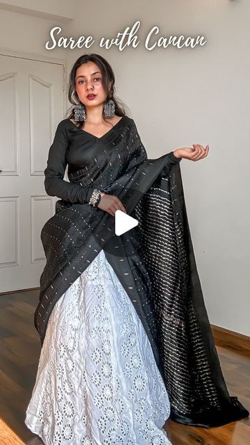 𝐀𝐫𝐜𝐡𝐞𝐞 | Saree Drapes on Instagram: "Save and send this Saree on Lehenga tutorial to a saree lover 🖤

Draped a pure silk saree in mulberry with tanchoi weave on deep black body topped with sterling silver zari woven 1000 butas and a classy double border.

Created a unique saree draped or unique saree styling tutorial for saree beginners. Paired it with a cancan and a long flared skirt. Added oxidised jewellery to complete the look.

How to wear a saree on cancan-
🖤 Pick lightweight pure silk sarees fabric like Katan silk, mulberry silk, tussar silk, khaddi chiffon, khaddi georgette, gajji silk and assam silk.
🖤 Layer up your cancan as much as you want but make sure it’s easy to walk in.
🖤 You can drape the saree in half saree pattern or as a regular saree depending upon the fabri Saree Into Half Saree Designs, Styling Saree With Tops, Saree With Skirt Style, How To Wear Saree In Lehenga Style, Saree To Lehenga Draping, How To Wear Half Saree, Half Saree With Saree, Saree With Lehenga Drape, Lehenga Designs From Saree