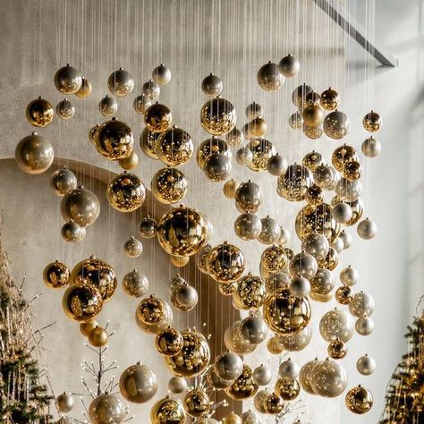 Suspended Christmas Decorations, Holiday Restaurant Decor, Restaurant Christmas Decor Ideas, Ornaments Hanging From Ceiling, Christmas Decoration Restaurant, Christmas Decorations Ceiling, Hanging Ornaments From Ceiling, Olive Green Velvet Sofa, Restaurant Christmas Decor