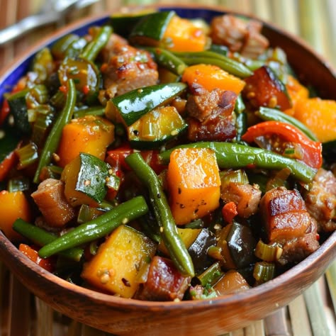 🌿 Enjoy a healthy and flavorful Filipino vegetable dish with Pinakbet! 🌿 #Pinakbet #HealthyEating Pinakbet Ingredients: Pork belly (1/2 lb, sliced) Bitter melon (1, sliced) Eggplant (1, cubed) Squash (1 cup, cubed) String beans (1 cup, cut into 2-inch pieces) Okra (1 cup, cut into 2-inch pieces) Tomatoes (2, quartered) Onion (1, chopped) Garlic (4 cloves, minced) Fish sauce (2 tbsp) Water (1 cup) Shrimp paste (2 tbsp) Instructions: Sauté garlic, onion, and tomatoes until soft. Add pork be... Pinakbet Recipe Filipino Food, Pinoy Food Filipino Dishes, Pinakbet Recipe, Filipino Vegetable Dishes, Filipino Ulam, Filipino Vegetable Recipes, Best Filipino Recipes, Sliced Eggplant, Twist Recipes