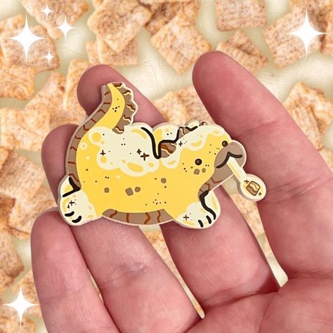 Soft dyed enamel pins my beloved !!!!! Here’s my cinnamon cereal dragon, part of a balanced breakfast 😤🤍✨ — #smallbusiness #merchartist #kidcore #cuteart #stickershop #shopsmall #00skid #90skid #nostalgia #stickercollector #giftideas #happymail #healingmyinnerchild #digitalart #sillyart #dragon #enamelpin #pincollector #breakfast Enamel Pins Aesthetic, Cute Pins For Backpacks, Cinnamon Cereal, Pins For Backpacks, Balanced Breakfast, Stationary Supplies, Ita Bag, Random Items, Soft Enamel Pins