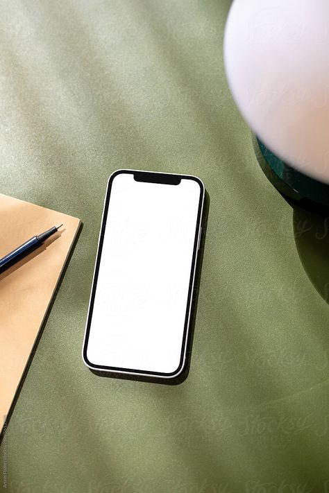 "A Mock-up Of A Mobile Phone With A White Screen On A Green Table" by Stocksy Contributor "Artem Podrez" - Stocksy Phone On Table, Clifford Chance, Iphone Mockup Psd, Vision Ideas, Hand Holding Phone, Up Photoshoot, Phone Table, Minimalist Background, Phone And Laptop