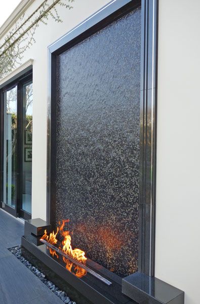 Outdoor Water Wall Feature, Granite Water Feature, Outdoor Wall Water Features, Fire And Water Feature Outdoor, Water Feature Wall Outdoor, Modern Water Feature Entrance, Outdoor Mirror Ideas, Modern Water Feature Wall, Waterfall In House