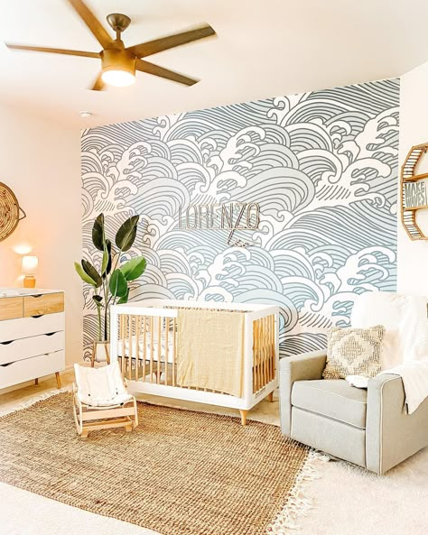 Source: Instagram / @melmarvelous_ All this mama needs is to play soundtracks of waves crashing on the shore, and this will be the best nursery! The room feels so comforting, from the waves accent wall to the natural materials from each decor item. The textured rug does not just add warmth to the space but also ties the room’s overall look. Baby Boy Nursery Wave Wallpaper, Waves Nursery Wall, Diy Beach Nursery Decor, Ocean Wave Nursery, Nursery Ideas Ocean Sea Theme, Waves Wallpaper Nursery, Surf Nursery Decor, Modern Ocean Themed Nursery, Neutral Surfer Nursery