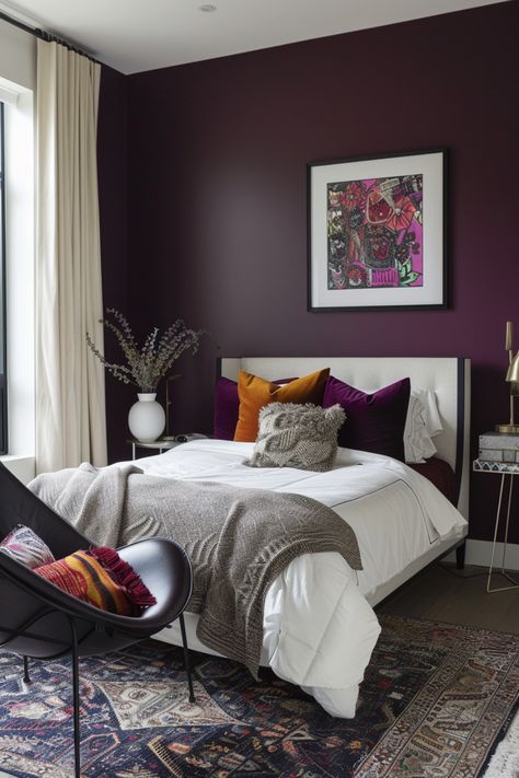 Discover 14 minimalist, colorful boho bedroom decor ideas. Transform your space with vibrant accents, simple designs, layered textiles, and natural elements. Embrace a blend of minimalism and boho charm for a cozy, stylish retreat that reflects your unique taste. Neutral Bedroom With Purple Accents, Deep Purple Room Ideas, Plum And White Bedroom, Plum Purple Room, Plum Master Bedrooms Decor, Purple Headboard Bedroom Ideas, Small Girly Bedroom Ideas, Purple Paint Room, Eggplant Bedroom Walls