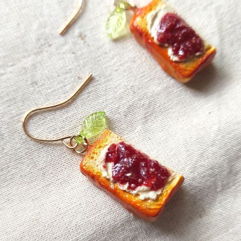 These miniature toast earrings, complete with a dollop of butter and a drizzle of jam, are perfect for adding a touch of whimsy to your outfit. Handmade with love and attention to detail, these earrings are sure to brighten your day.

Order yours today and let your inner foodie shine! Toast Earrings, Y2k Stuff, Shopee Malaysia, My Melody Kuromi, Hello Kitty My Melody, Playboy Bunny, Miniature Crafts, Handmade Miniatures, Earrings Collection