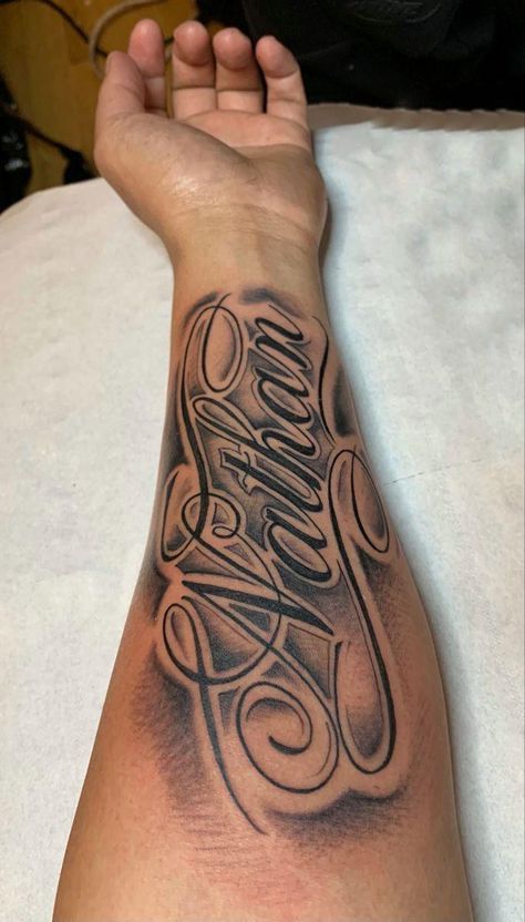 Name Style Tattoos, Name Tattoo On Bicep, Arm Tattoos For Guys Forearm Ideas, Name Tattoo With Shading, Sleeve Tattoos With Names, Last Name On Arm Tattoo, Men Name Tattoos For Women, Forearm Tattoos Lettering, Men’s Name Tattoos