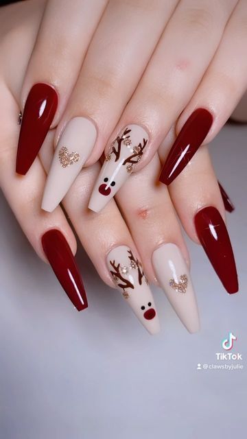 It can be anything, as long as it's holiday-themed! Christmas Nails Rain Deer, Wine Christmas Nails, Christmas Nail Designs 2023, Reindeer Nails Designs, Christmas Reindeer Nails, December Nails Red, Christmas Nails Reindeer, Christmas Nails Design Holiday, Cute December Nails