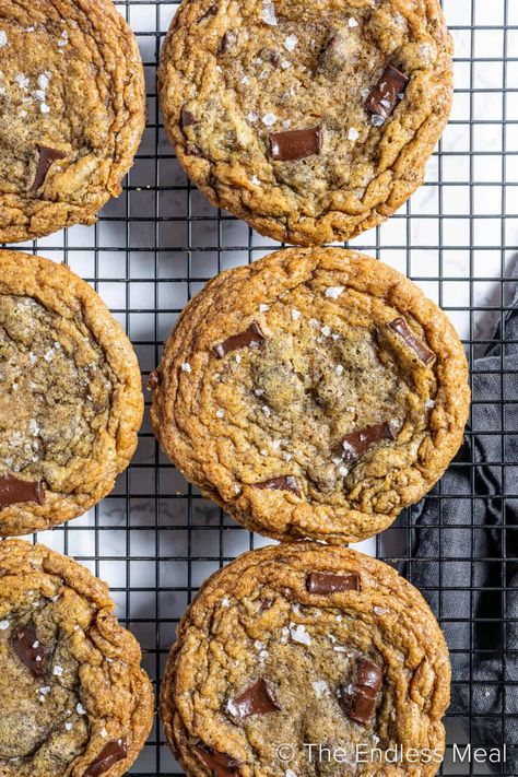 These brown butter sea salt chocolate chip cookies are worth hiding from the kids! Ok, or at least make a double batch so there's more than enough to go around. The crisp edges and buttery soft centers are what dreams cravings are made of. #theendlessmeal #cookies #brownbutter #chocolatechip #chocolate #dessert #chocolatedessert #holidaycookies #christmascookies #chocolatechipcookies #brownbuttercookies Salted Chocolate Chip Cookies Recipes, Salt Cookies Recipe, Sea Salt Chocolate Chip Cookies, Salt Chocolate Chip Cookies, Salted Chocolate Chip Cookies, Brown Butter Cookies, Brown Butter Chocolate Chip Cookies, Caramel Chocolate Chip Cookies, Sea Salt Chocolate