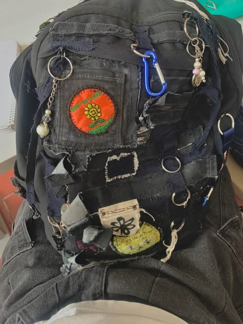 Alternative Backpack, Senior Year Backpack, Folk Punk Aesthetic, Diy Punk Clothes, Tlou Oc, What's Inside My Bag, Maximalism Art, Alt Diy, Punk Bag