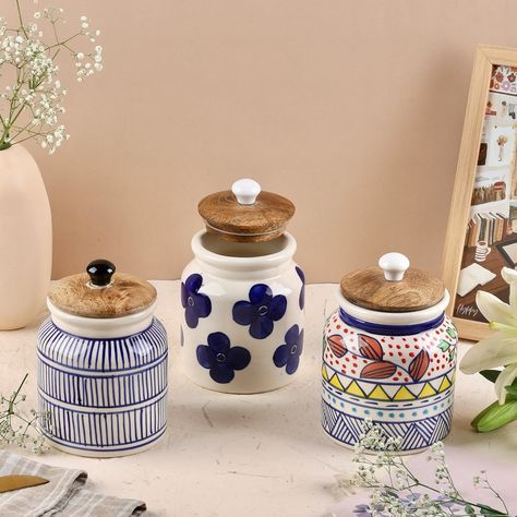 Revamp your storage game with our airtight ceramic jars with wooden lids for a cute yet functional organized look. Use them for masalas, pulses, tea, coffee, sugar and more! Free of any toxins or lead, our ceramics are a healthy and sustainable choice for every home. Available individually and as a set of 3 Airtight jar, ceramic jar, kitchen storage, airtight container, kitchen organization, handpainted ceramics Ceramic Jars Kitchen, Sugar Tea Coffee Containers, Jars With Wooden Lids, Jar Kitchen Storage, Tea Coffee Sugar Jars, Pantry Decor, Jar Ceramic, Container Kitchen, Coffee Container