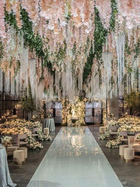 This wedding reception was all about luxe floral arrangements and chic yet cozy lounge areas | wedding inspo, wedding planning, luxury wedding planner, wedding planner, indoor wedding reception, wedding reception decorations, wedidng reception ideas, winter wedding inspo, fall wedding, wedding aisle decor, wedding lounge areas, wedding flowers, floral wedding, luxury wedding decor, pastel wedding, wedding lounge decor, wedding arch, wedding floral designs #weddingreception #weddingceremonydecor Wedding Decor Pastel, Indoor Garden Wedding Reception, Wedding Lounge Decor, Aisle Decor Wedding, Pastel Wedding Decorations, Wedding Ceiling Decorations, Indoor Wedding Reception, Wedding Aisle Decor, Wedding Ceiling