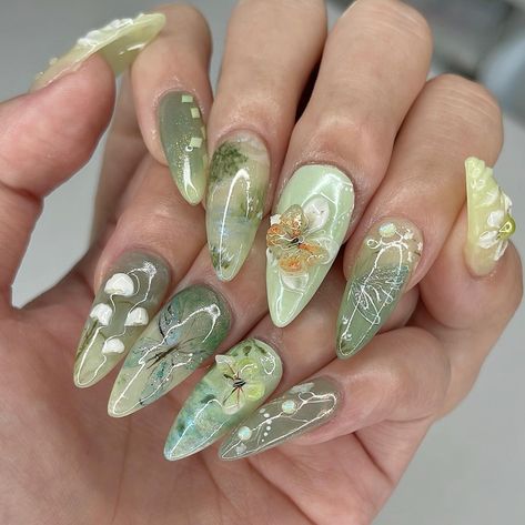 🧚🏻‍♂️ green fairy meadow 🍃 I can’t help but say I slayed this set 💯💚 my top 3 fairycores for sure 🤭 My custom design on a Medium Stiletto @apresnailofficial Gel-X, client asked for fairycore and left everything up to me ✨ #nailinspo #naildesign #vancouvernails #fairycorenails #gardennails #naturenails #nails2inspire #trendynails #gelxinspo #pinterestnails #summernails #springnails #3dflowernails #3dnailart Princess Tiana Inspired Nails, Green Stilletto Nails, Aug Nails, Tiana Nails, Fairy Nails Designs, Green Aesthetic Nails, Fairy Inspired Nails, Green Fairy Nails, Enchanted Forest Nails