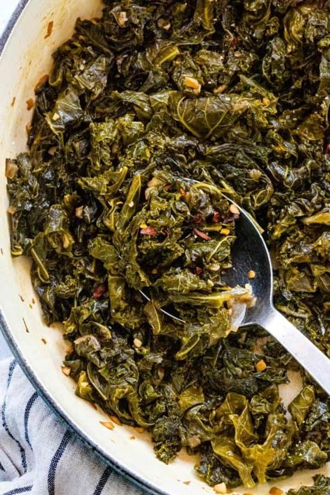 Braised kale is a simple way to tenderize and deepen the flavor. The greens first saute to maximize the aromatics in the dish then get covered and simmer. #kale #braisedkale #healthyrecipes #sidedish Stewed Kale Recipes, Soul Food Kale Greens, Kale Southern Style, Kale Greens Recipe Southern Vegan, Braised Greens Recipes, Hot Kale Recipes, Cooked Kale Recipes Southern, Southern Kale Greens, Southern Kale Recipes