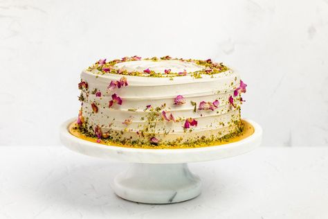 Our pistachio and rose cake is our best seller. It features three layers of light vanilla sponge sandwiched with sweet, nutty pistachio and rose cream. It’s finished with a fresh vanilla cream, then delicately decorated with crumbled pistachio pieces and hand-dried, edible rose petals. This cake can be personalised with a message of your choice. Pistachio Wedding Cake, Rose Petal Cake, Diamond Wedding Cakes, Edible Rose Petals, Edible Flowers Cake, Edible Roses, Petal Cake, Wedding Cake Roses, Pistachio Cake