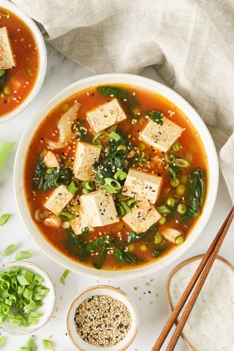 A bowl of tofu soup garnized with chopped green onions, sesame seeds, and chili flakes. Vegetable Tofu Soup, Firm Tofu Soup, Soups With Tofu, Tofu In Soup, Asian Tofu Soup, Tofu Soups, Silken Tofu Soup, Tofu Soup Recipes, Soft Tofu Recipes