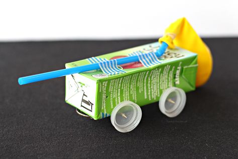 Juice Box Balloon Car Craft with Juicy Juice - Raising Whasians Build A Car Stem Activity, Juice Box Crafts, Wind Powered Car Stem Project, Boxcar Children Project, Rubberband Car Science Projects, Recycled Toy Car, Balloon Powered Car, Toys From Trash, Balloon Cars