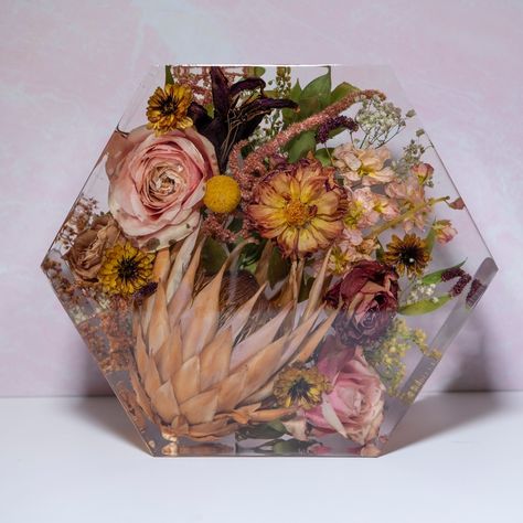 It's time for another #FeaturedProductFriday 🎉 Today we are showcasing one of our main pieces, the 9 inch Hexagon! This is our MOST popular size and shape of all the main pieces we offer. The 9 inch size offers enough space for a good portion of your bouquet, while still having some flowers left over for a few additional smaller pieces, and the hexagon shape is just plain fun! If you're interested in saving your flowers, we have lots of information including products and pricing on our webs... Resin Plaque, Wedding Flower Preservation, Memorial Wedding, Floral Preservation, Flower Preservation, Flowers Petals, Preserved Flowers, Dried Flower Arrangements, Wedding Memorial