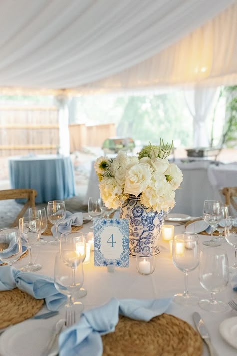 We loved being a part of this wedding at Canoe Restaurant and providing our Sky Linens, Hemstitch Napkins and White Table runners to bring this beautiful design by Gloria Schulz Events to life! We also cannot get enough of these beautiful ginger jars and wicker elements, florals by Pollyanna Richter Weddings and photographed by Maddie Sullivan. White Linen Table Setting Wedding Ideas, Blue And White Vase Centerpiece Wedding, Chinoiserie Wedding Table Settings, Coastal Table Setting Wedding, Blue White Chinoiserie Wedding, Wedding Flower Blue And White, Costal Wedding Centerpiece, Blue Tuscan Wedding, Ginger Jar Wedding Reception