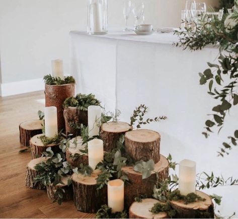 Simply logs, candles and foliage creates the most amazing woodland displays at Doxford Barns Wood Log Wedding Decor, Log Table Centre Pieces, Forest Wedding Signs, Rustic Wedding Top Table, Main Table Wedding Decoration, Muskoka Elopement, Woodland Display, Sweetheart Table Candles, Wood Centerpieces Wedding