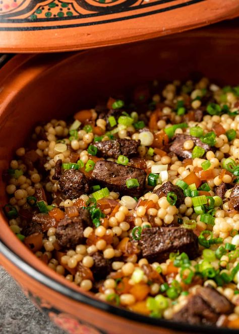 This lamb and pearl couscous recipe is a mouthwatering combination of marinated lamb, sauteed veggies, and fluffy pearl couscous. Lamb And Couscous, Lamb And Couscous Recipes, Lamb Couscous Recipes, Lebanese Couscous Recipes, Lamb Sausage Recipes Dinners, Pearl Cuscus Recipes, Lamb Cubes Recipes, Roasted Couscous, Giant Couscous Recipes