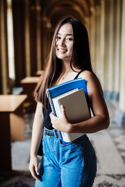 Confident asian student holding books an... | Free Photo #Freepik #freephoto #books #computer #education #woman Hold Book Reference, Student Portrait Photography, Pose With Book Reference, Carrying Books Pose, Person Holding Book Reference Drawing, Holding Books Reference, Holding Books Pose, Person Holding Book Reference, Holding Book Pose Reference