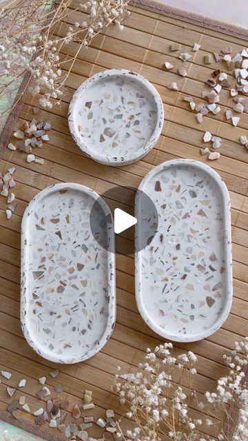 Pepper Please Studio | Jesmonite | Workshops on Instagram: "Bestseller! Seashells terrazzo in the making! Material: Jesmonite @jesmonite_ltd @mad.mayker . . . #jesmonite #jesmonitehomeware #terrazzo #jesmoniteterrazzo #mixing #pouring #shells #seashells #beachvibes #handmade #homedecor #workshop #howto #diy #giftideas #smallbusiness #supportlocal #sustainable #nontoxic #nontoxicart #art #aesthetics #oceanvibes #create #satisfying #satisfyingvideos" Concrete And Resin Diy, Jesmonite Jewellery, Jesmonite Diy, Jesmonite Art, Jesmonite Ideas, Diy Terrazzo, Concrete Trays, Cement Tray, Jesmonite Terrazzo