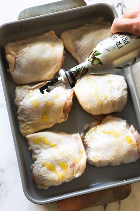 The flavor of these perfectly roasted chicken thighs is incredible. This easy 5-ingredient oven-baked bone-in chicken thigh recipe is the perfect staple recipe and easy weeknight dinner. These low-carb chicken thighs are super-juicy with the crispy skin you want. Use this recipe for meal prep and batch cooking too. | Real Simple Good Chicken In Bone Recipes, Skin On Chicken Thigh Recipes Oven Baked, Skinned Chicken Thigh Recipes, Quick Bone In Chicken Thigh Recipes, Baked Chicken Thigh Recipes Bone In, Chicken Thigh Marinade For Oven, Skin On Bone In Chicken Thigh Recipes Healthy, Simple Chicken Thigh Recipes Easy, Baked Chicken Thigh Recipes Boneless