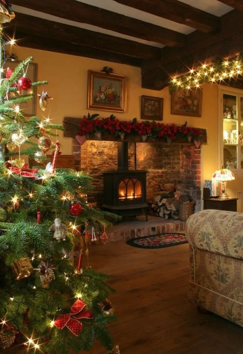 Festive Wood Burning Stove Decoration Ideas for the Holidays Christmas Fireplace Decor, Cosy Christmas, Cottage Christmas, Christmas Cottage, Christmas Living Rooms, Christmas Fireplace, I Love Christmas, Noel Christmas, Wood Burning Stove