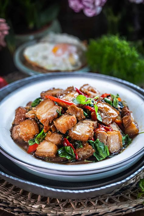 This Thai basil pork belly (Kra Pao Moo Krob) is a delicious Thai dish with crispy pork belly, fragrant Thai holy basil, and a perfect blend of sweet and spicy sauce. The best part? It's super quick to make, ready in less than 15 minutes! #porkbellybasil #thaiporkbellybasil #krapaomookrob #mookrobkrapao #porkbellystirfry #thaicrispyporkbellystirfry #krapaomoogrob #crispyporkbelly