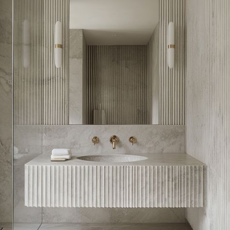 Your bathroom should be a sanctuary - where elegance meets calm. This space, featuring fluted stone walls, adds texture and depth for a serene, spa-like feel. The right materials can turn any bathroom into a place to de-stress and recharge. Design with purpose 🤍 #interiors #interiordesign #bathroomdesign #bathroom #interiordesigner #luxury #luxurylifestyle #calm #stonewalls #residential #residentialdesign #toronto #torontodesigner #highend #designer Fluted Stone Wall, Fluted Marble Wall, Toilet Counter, Fluted Stone, Fluted Marble, Desert Sun, Stone Walls, Marble Wall, Residential Design