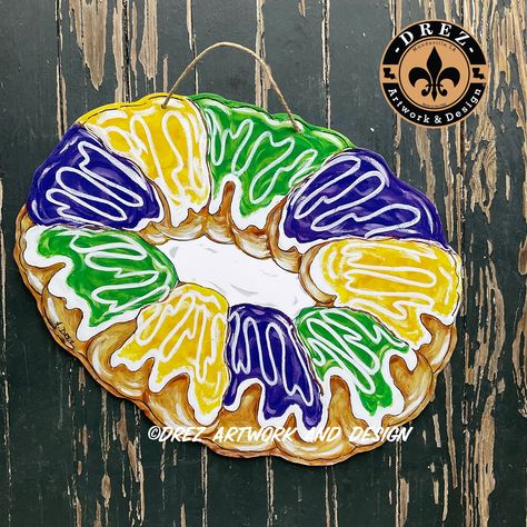 "This King Cake Door Hanger is the perfect addition to your Mardi Gras decorations  It is approximately 15x 24\".   It is a UV print made from my original artwork designed by me It is made of PVC making it extremely durable, waterproof and lightweight.  This would be a great Christmas present for someone on your list being Mardi Gras season is right after Christmas! If wanting to SAVE ON SHIPPING and thinking of ordering 2 pieces from all of my listings, we can put 2 pieces inside one box to low