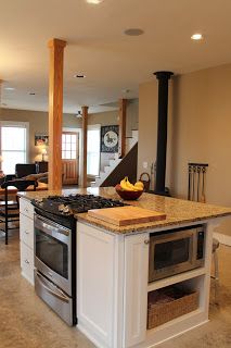 Whole house vent system eliminates need for vent above island stove, whilst meeting code reqs Island Stove, Kitchen Island With Cooktop, Island With Stove, Kitchen Island With Stove, Red Farmhouse, Rustic Kitchen Island, Small Kitchen Island, Stools For Kitchen Island, Fabulous Kitchens