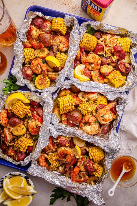 Easy Cajun Shrimp Boil Foil Packs (Oven or Grill!) Shrimp Boil In Oven, Easy Cajun Shrimp, Shrimp Boil Foil Packs, Cajun Shrimp Boil, Shrimp Grilled, Shrimp Boil Foil, Shrimp Boil Recipe, Potatoes And Corn, Shrimp Corn