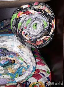 My Quilty World: Rolling a Quilt for Storage Folding A Quilt For Storage, How To Store Quilts, How To Fold A Quilt For Storage, Folding Quilts For Storage, Quilt Storage Ideas, Quilt Club, How To Roll, Bonnie Hunter, Quilt Storage