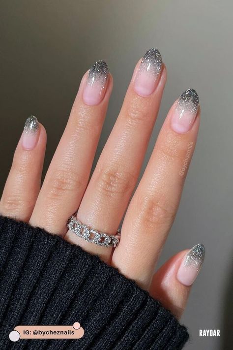 While black nails can feel like a bold choice, they’re perfect for getting creative. You can play with everything from sleek matte finishes to eye-catching details that really stand out. Our beauty editors rounded up ten black nail ideas that are a must this season. #blacknails #blacknailideas Silver Nails New Years, Nail Art New Years Eve, Glittery Silver Nails, New Years Nails Silver, Silver Ombre Nails, Holiday Nails 2022, New Year Eve Nails, Silver Sparkle Nails, Brady Quinn