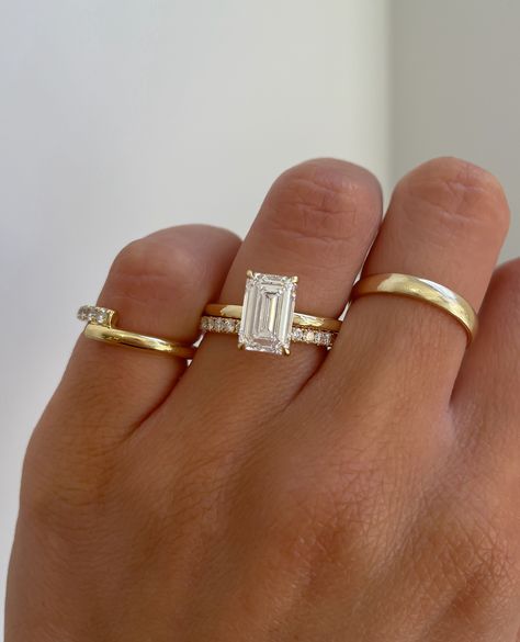 A stunning emerald cut solitaire engagement ring paired with a classic pave wedding ring. Solitaire Emerald Engagement Ring With Band, Emerald Cut Wedding Ring And Band, Emerald Pave Wedding Band, Simple Gold Engagement Rings Emerald, Emerald Simple Engagement Rings, Emerald Ring And Band, Square Cut Engagement Ring With Band, Wedding Rings Gold Emerald Cut, Emerald Cut Rings Gold