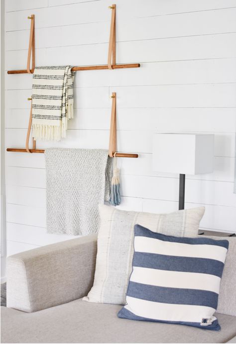 Modern Blanket Ladder Made from Wooden Dowels and Leather straps attached to the Wall Blanket Ladder Attached To Wall, How To Display A Blanket On The Wall, Wide Blanket Ladder, Blanket Ladder Modern, Towel Storage On Wall, Modern Quilt Rack, Blanket Ladder On Wall, Wall Blanket Ladder, Hanging Throw Blankets On Wall