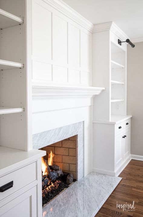 Fireplace Built Out Shelves, Fireplace Ideas With Bookcases, Fireplace Set Back In Wall, Built Ins Around A Fireplace, Cabinets And Fireplace, Storage On Either Side Of Fireplace, Fireplace Mantel With Bookcases, Bookshelf Surrounding Fireplace, Lighting Over Bookshelves