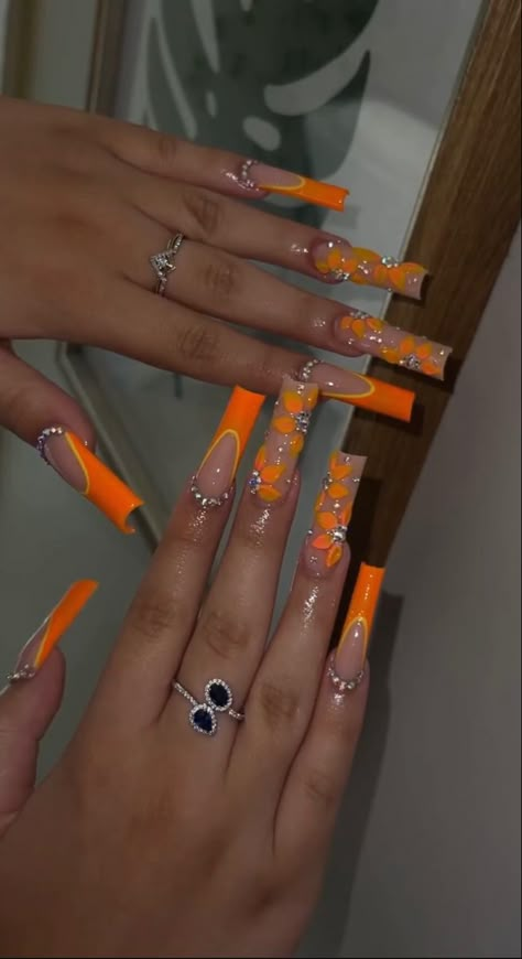 Orange Acrylic Nails Prom, Orange Nails With Initial, Long Nails Coffin Summer, Orange Medium Acrylic Nails, Extravagant Nail Designs, Orange Sets Nails, Orange Nail Styles, Orange Nails Rhinestones, Neon Yellow Design Nails