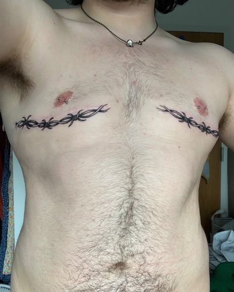 Trans Scar Tattoos on Instagram: “Here is @whack.k with sick piercings and ink over the scars! 🖤 Submit your own trans surgery scar tattoo cover ups/incorporation by DM to…” Pelvis Tattoos Men, Trans Men Tattoo Ideas, Trans Guy Tattoo, Top Sergury Scar Tattoos, Trans Men Chest Tattoos, Tattoo Ideas Top Surgery, Ftm Scar Tattoo Cover Up, Tattoo Ideas Gender Neutral, Dysphoria Tattoo