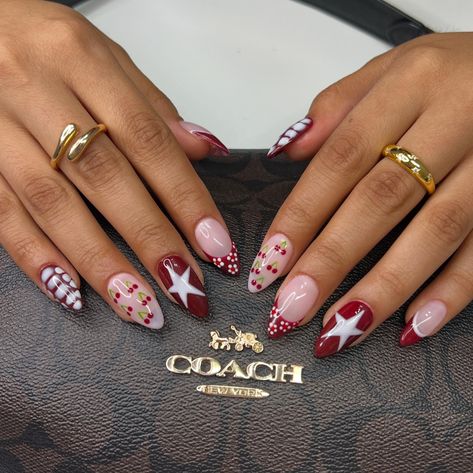 🍒⭐️🍷 • • • • #nailsxkay #nailsnailsnails #apresnails #gelx #gelxnails #prettynails #trendynails #naildesign #nailart #nailextentions #bombnails #cutenails #baddienails #nailinspo #pinterestnails #trendynails #explore #explorepage #scvnails #calinails #LAnails #nailsofinstagram #fallnails #rednails #darkrednails #winenails #starnails #cherrynails #flowernails #crocprintnails Hailey Bieber Christmas Nails, Fun Vegas Nails, Pretty Christmas Nail Designs, Fun Holiday Nails, Nails With Red Design, Red Nails With Stars, Funky Winter Nails, Nails For Vegas Trip, Vintage Christmas Nails