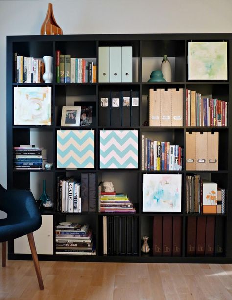 Use painted canvas squares to cover sections of the shelf, via danslelakehouse.com | 9 Easy Ways To Hide Clutter On Shelves Ikea Expedit Hack, Kallax Bookcase, Expedit Hack, Kallax Office, Ikea Expedit Bookcase, Kallax Playroom, Bookshelf Ikea, Popular Kitchen Designs, Ikea Kallax Hack