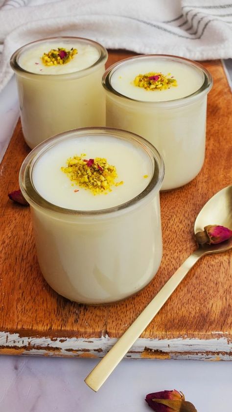 Mahalabia, also known as Muhallebi, Muhalabia, Mhalabia, Mahalebi, Mohallabiah, or Muhallabiyeh is a popular Middle Eastern milk pudding made with milk, corn flour, sugar, and flavored with rose water. Muhalabia Recipe, Muhalabia Dessert, Rice Flour Pudding, Mahalabia Recipe Desserts, Mahalabia Recipe, Lebanese Desserts Recipes, Middle Eastern Breakfast, Eid Dessert Recipes, Middle Eastern Dessert