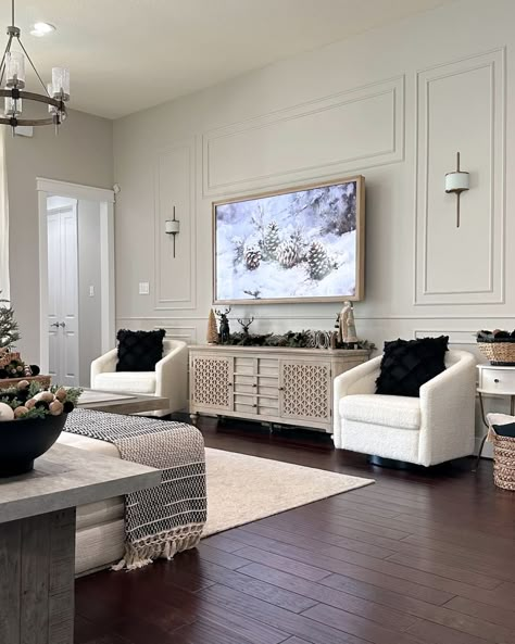 Holiday decor in newly renovated living room. Living Room Wainscoting Ideas Modern, Living Room Border Ideas, Box Trim Tv Wall, Big Wall With Tv Decor Living Room, Cozy Living Room Tv Wall, Large Wall Around Tv Decor, Framed Tv Wall Ideas, Tv On Large Wall Family Rooms, Long Blank Wall In Living Room