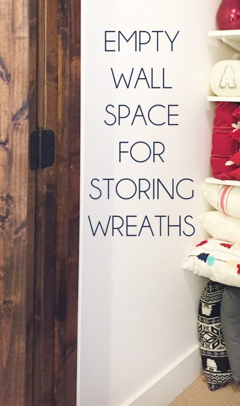 Inexpensive Wreath Storage Idea Wreath Storage Ideas Easy Diy, Best Way To Store Wreaths, Wall Of Wreaths, Wreath Organization Storage Ideas, Wreath Making Supply Storage, Storing Wreaths Ideas, Wreath Storage Ideas Organizing, How To Store Wreaths, Wreath Organization